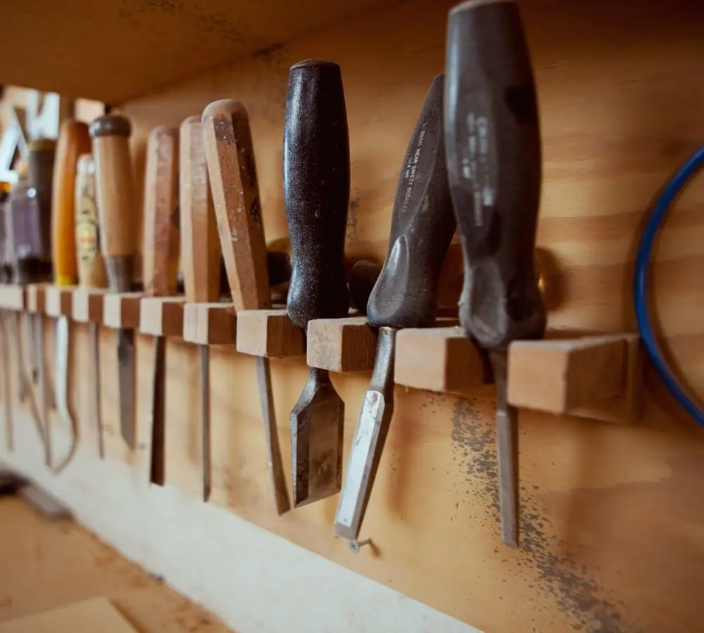 Wood chisels hanging in a woodshop