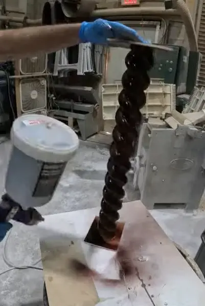 Applying a control stain to a barley twist table leg