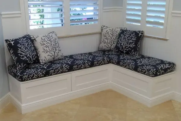White banquette with navy cushions