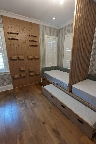 Childrens' bedroom with pegwall and trundle bed