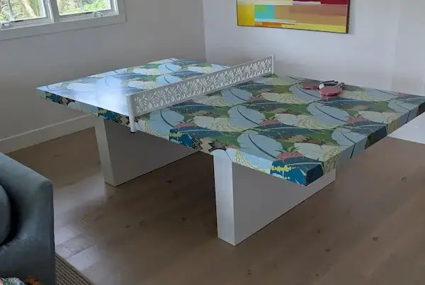 Ping pong table with custom pineapple pattern wood net