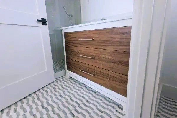 Bath vanity with black walnut drawers