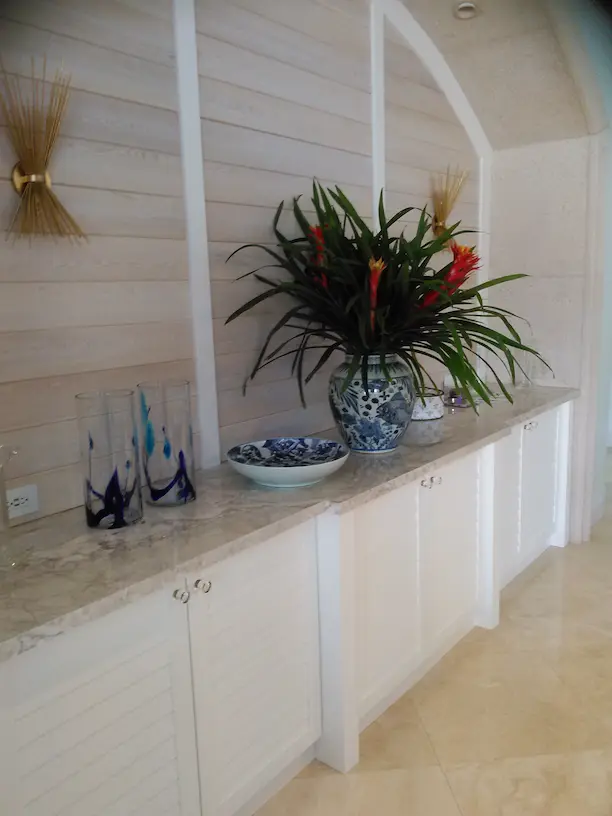 White buffet with cypress paneling