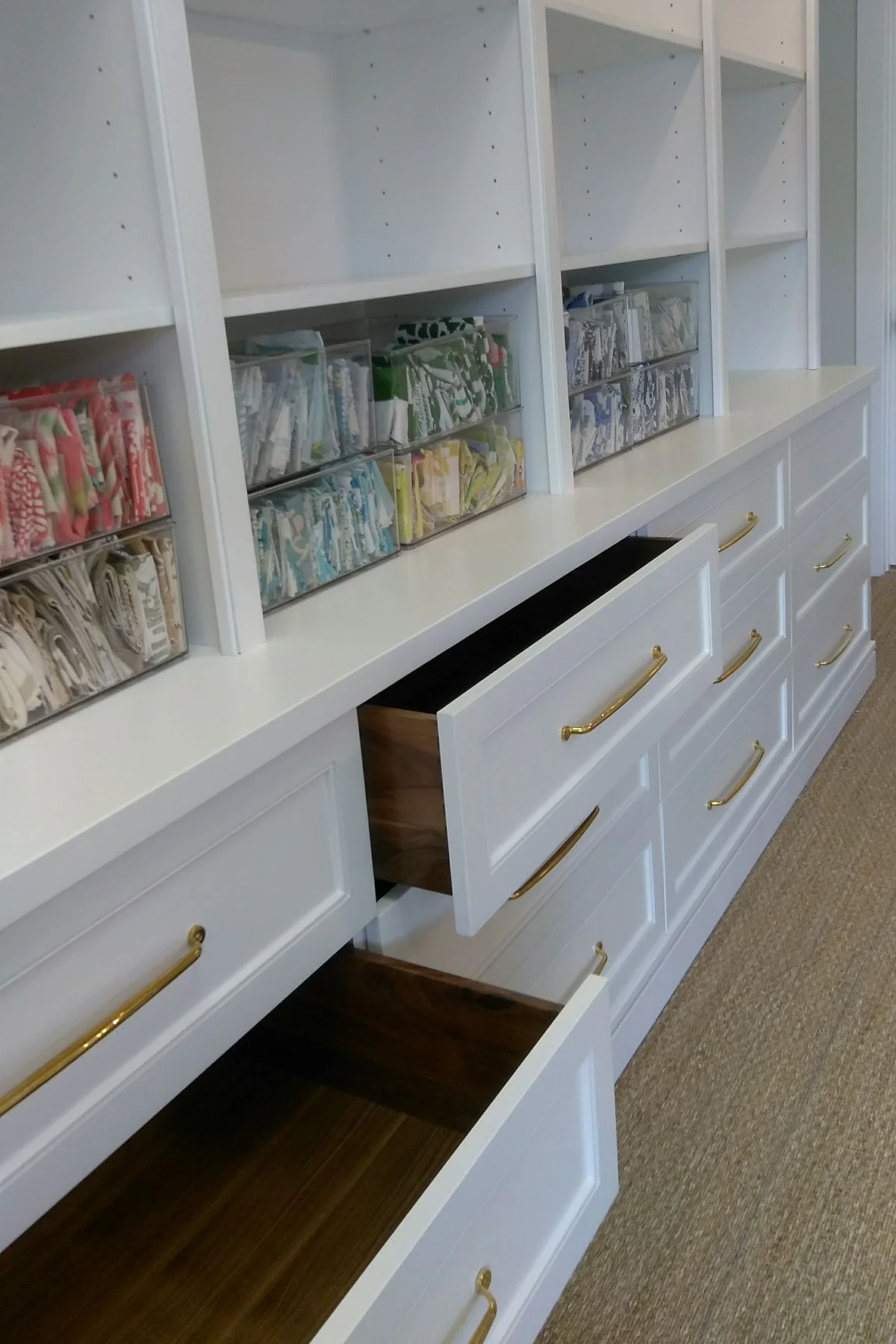 White shelving with black walnut drawer boxes