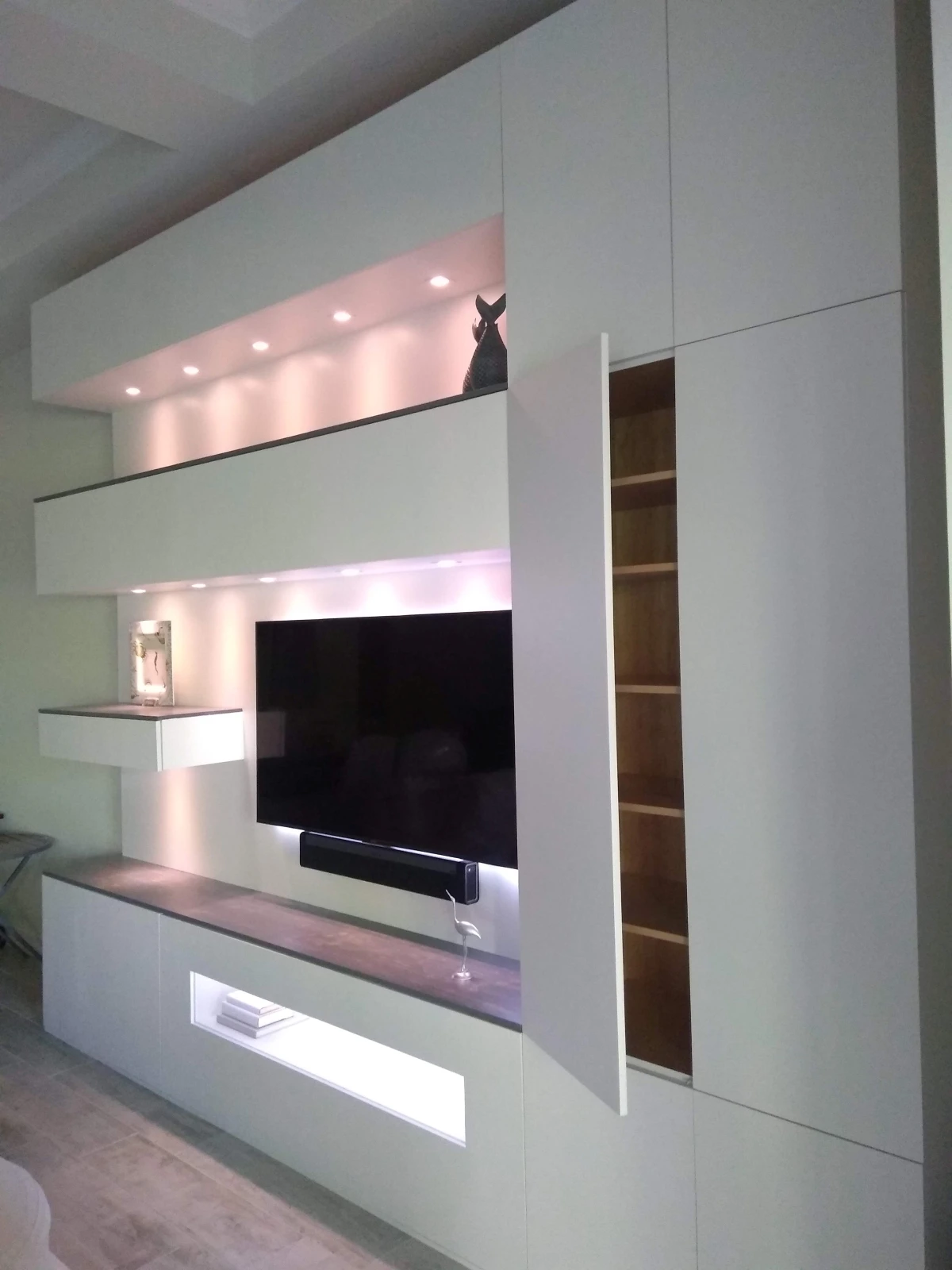Modern white entertainment center with LED lighting