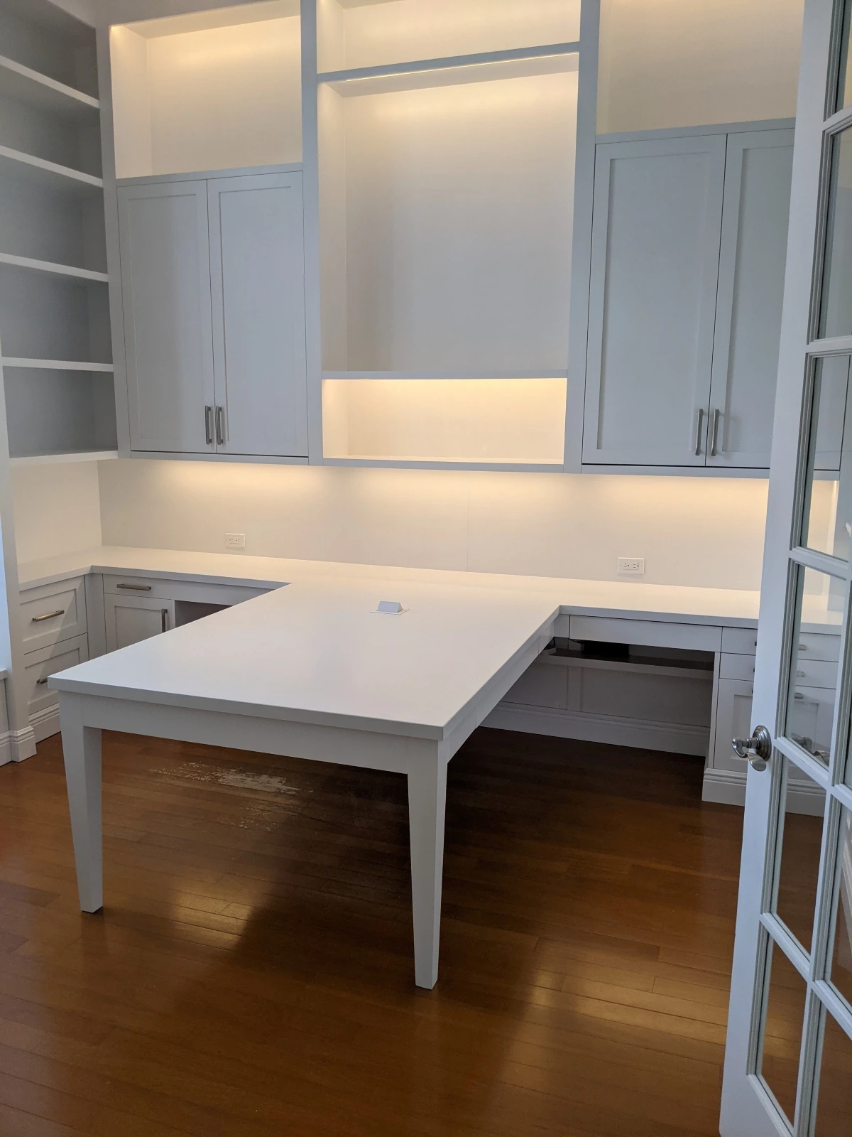 Custom office with white cabinetry