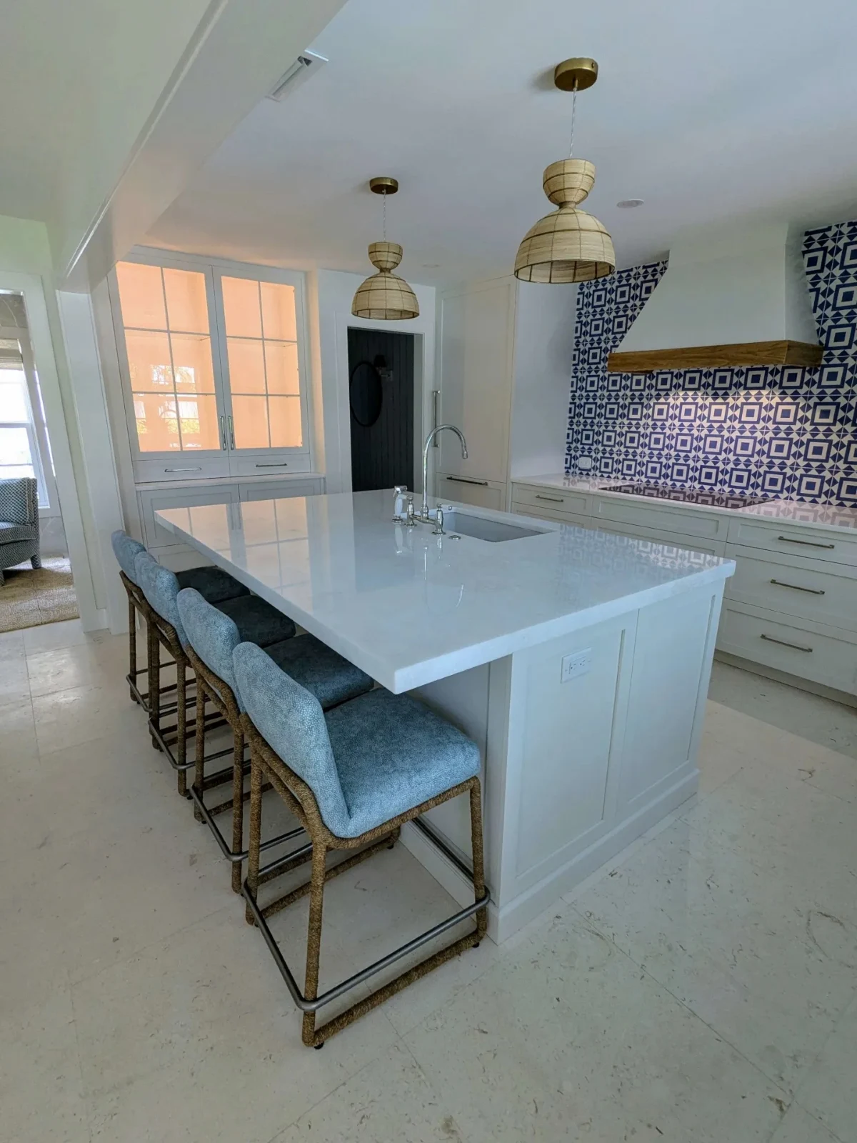 White kitchen with bright blue tile backsplash