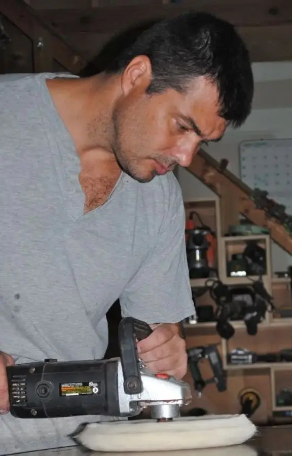 Kodama owner Tony Cirranello buffing a high gloss table top